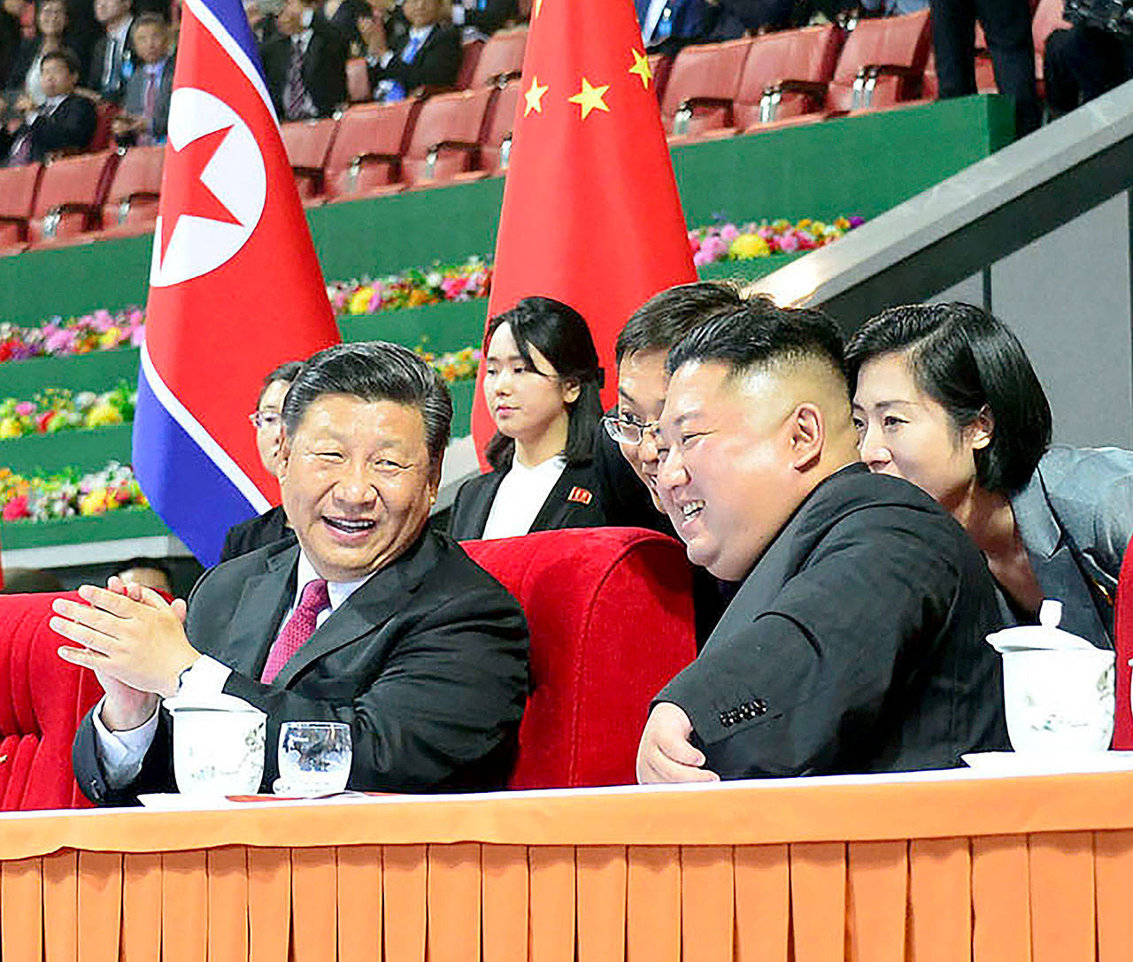 North Korean leader Kim Jong Un (right) and Chinese President Xi Jinping watch a gymnastics performance at the May Day Stadium in Pyongyang, North Korea, on Thursday. The content of this image is as provided and cannot be independently verified. (Korean Central News Agency/Korea News Service via AP)