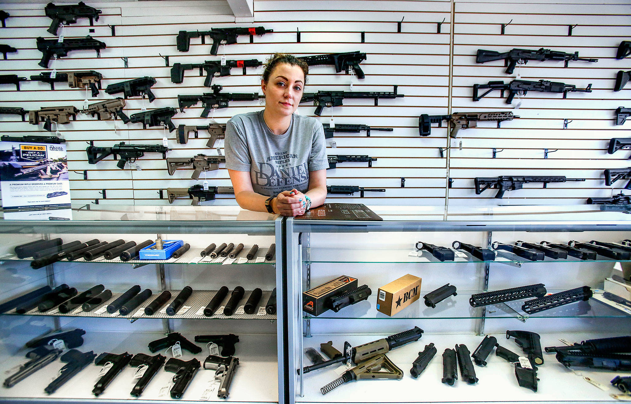 Tiffany Teasdale, co-owner of Lynnwood Gun & Ammunition, talks about new requirements that take effect Monday, due to voters’ approval of Initiative 1639. (Dan Bates / The Herald)