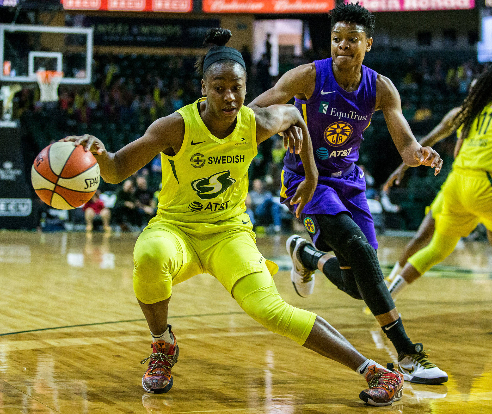 The Storm’s Jewell Loyd (front) tries to get around the Sparks’ Alana Beard during a game on June 21, 2019, at Angel of the Winds Arena in Everett. (Olivia Vanni / The Herald)