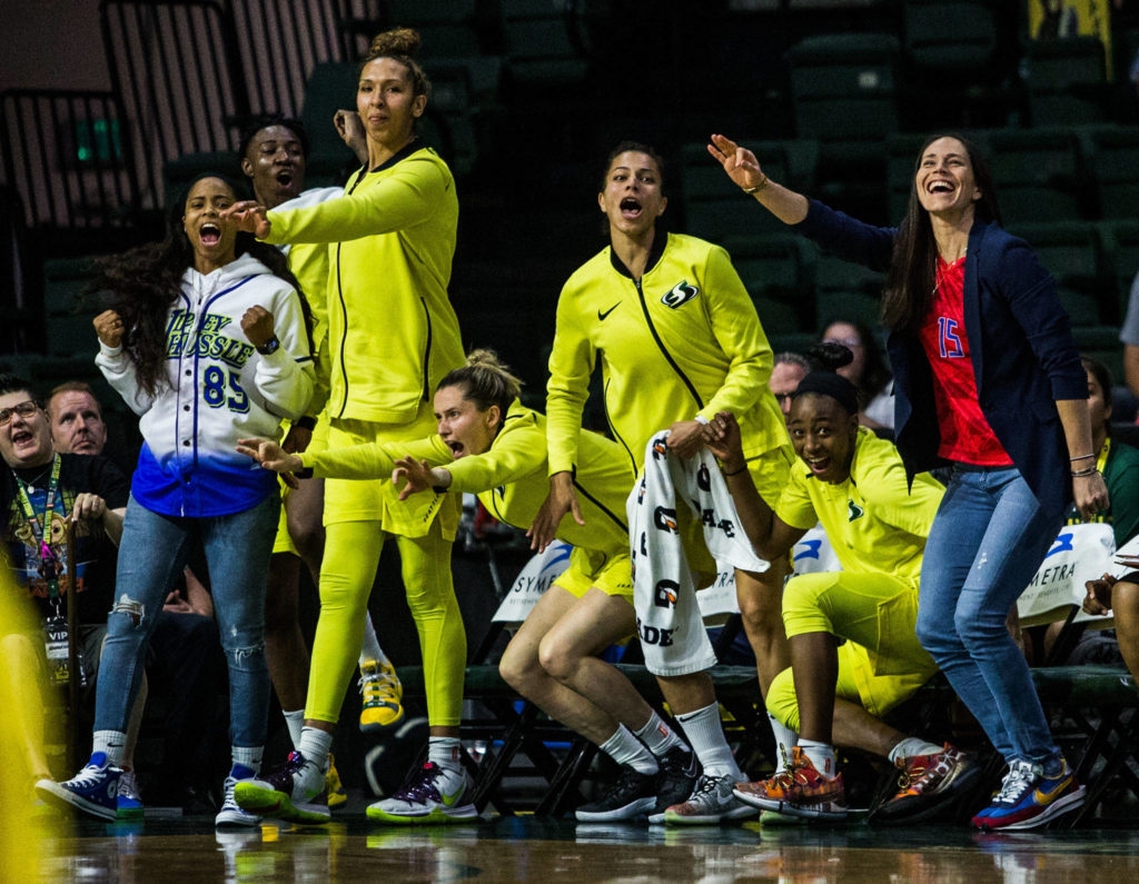 The Seattle Storm bench reacts to a three-point shot made by Crystal Langhorne in the final minutes of the game against the Los Angeles Sparks at Angel of the Winds Arena on Friday, June 21, 2019 in Everett, Wash. (Olivia Vanni / The Herald)