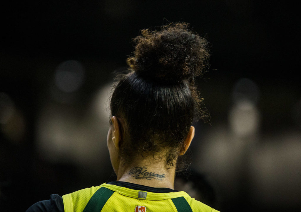 A tattoo with the phrase “blessed” on Seattle Storm’s Alysha Clark back during the game against the Los Angeles Sparks at Angel of the Winds Arena on Friday, June 21, 2019 in Everett, Wash. (Olivia Vanni / The Herald)
