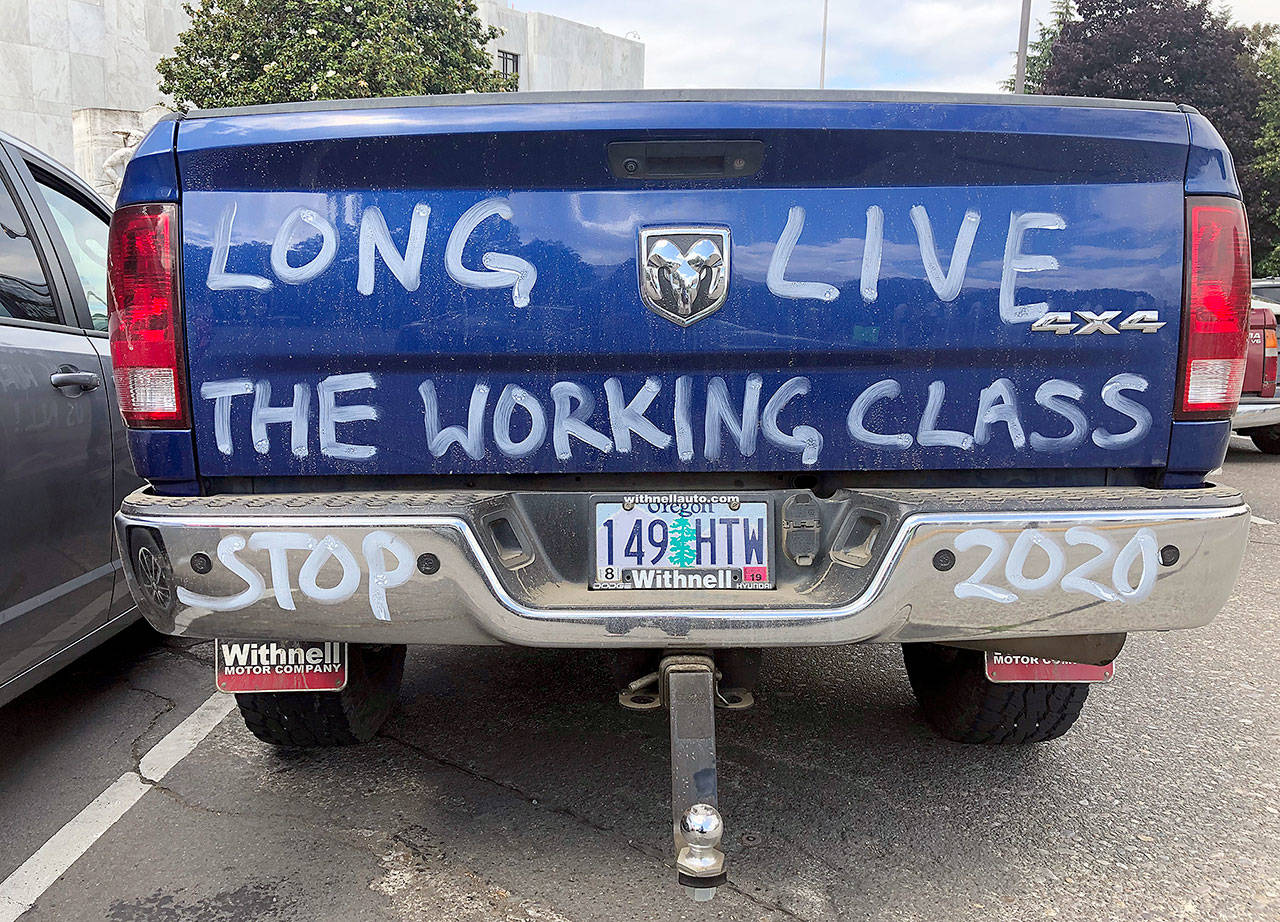 A diesel truck that belongs to a self-employed logger is parked in Salem, Oregon, on Thursday, the day the state Senate was scheduled to take up a bill that would create the nation’s second cap-and-trade program to curb carbon emissions. Senate Republicans, however, walked out so there wouldn’t be enough lawmakers present for a vote on House Bill 2020, which is extremely unpopular among loggers, truckers and many rural voters. (AP Photo/Gillian Flaccus)