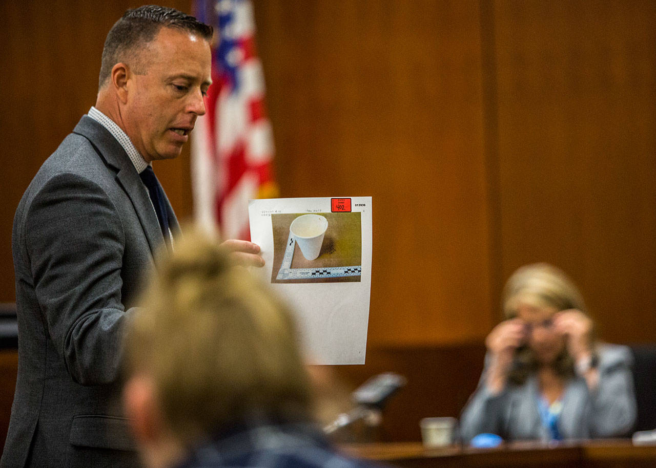 Deputy prosecutor Matt Baldock shows a photo of a paper coffee cup that was taken with William Talbott II’s DNA on it during the trial of William Talbott II at the Snohomish County Courthouse on Monday in Everett. (Olivia Vanni / The Herald)