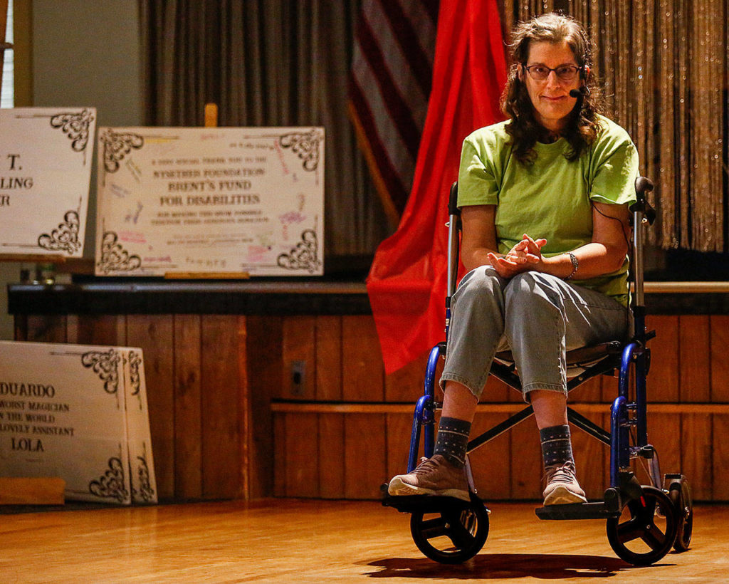 Heather MacDonald interprets the song “Twinkle, Twinkle Little Star” using a type of sign language Wednesday night during the All Aboard talent show, “Way Off Broadway.” (Dan Bates / The Herald)
