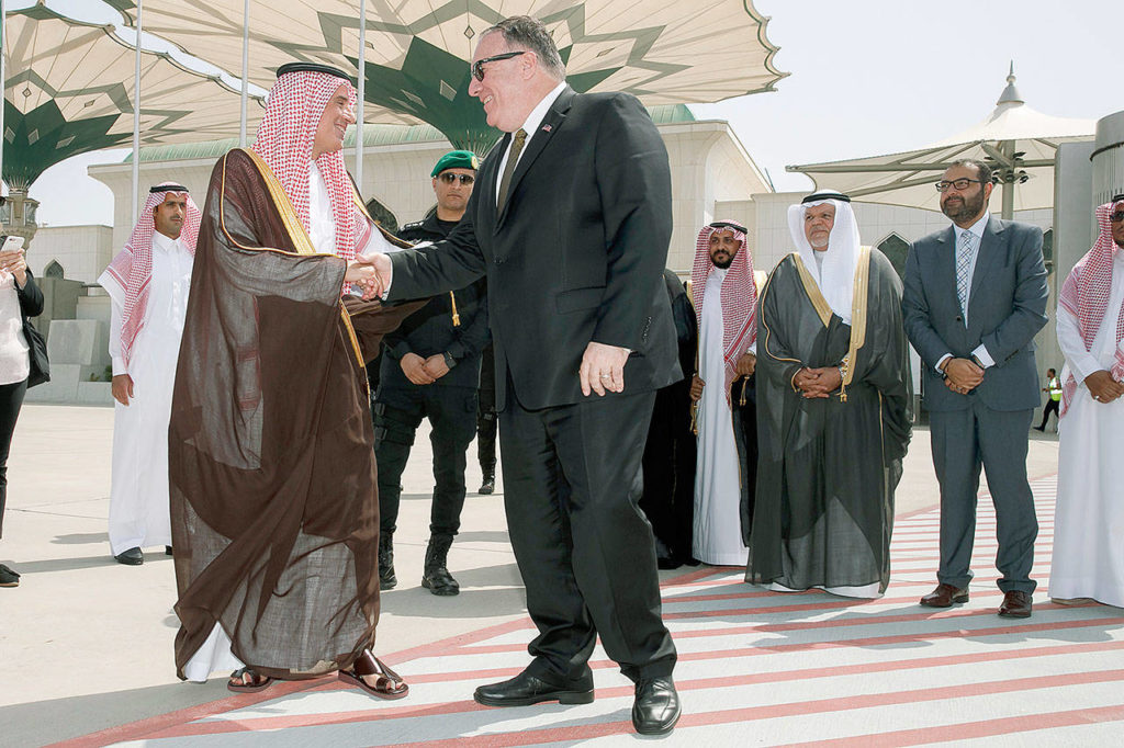 Secretary of State Mike Pompeo, center, shakes hands with Saudi Minister of State for Foreign Affairs Adel al Jubeir, as Pompeo departs Jeddah, Saudi Arabia, Monday, June 24, en route to Abu Dhabi. (AP Photo/Jacquelyn Martin, Pool)
