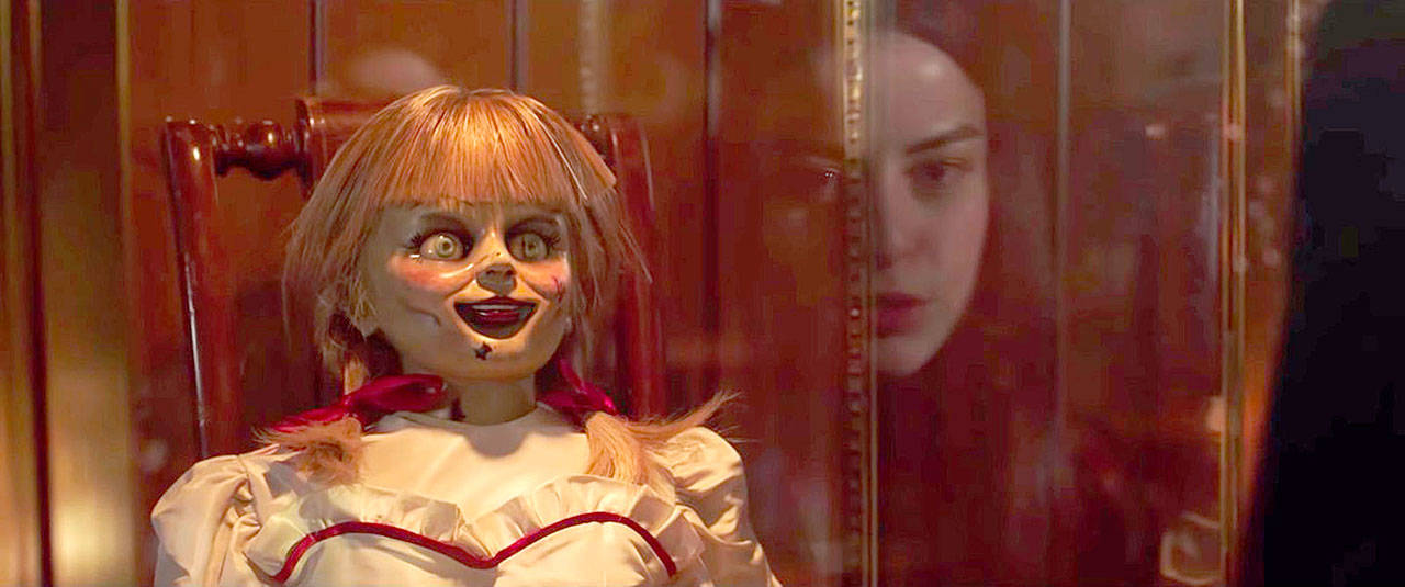 A feckless teenager (Katie Sarife) comes face-to-face with a creepy doll in “Annabelle Comes Home.” (Atomic Monster / New Line Cinema)