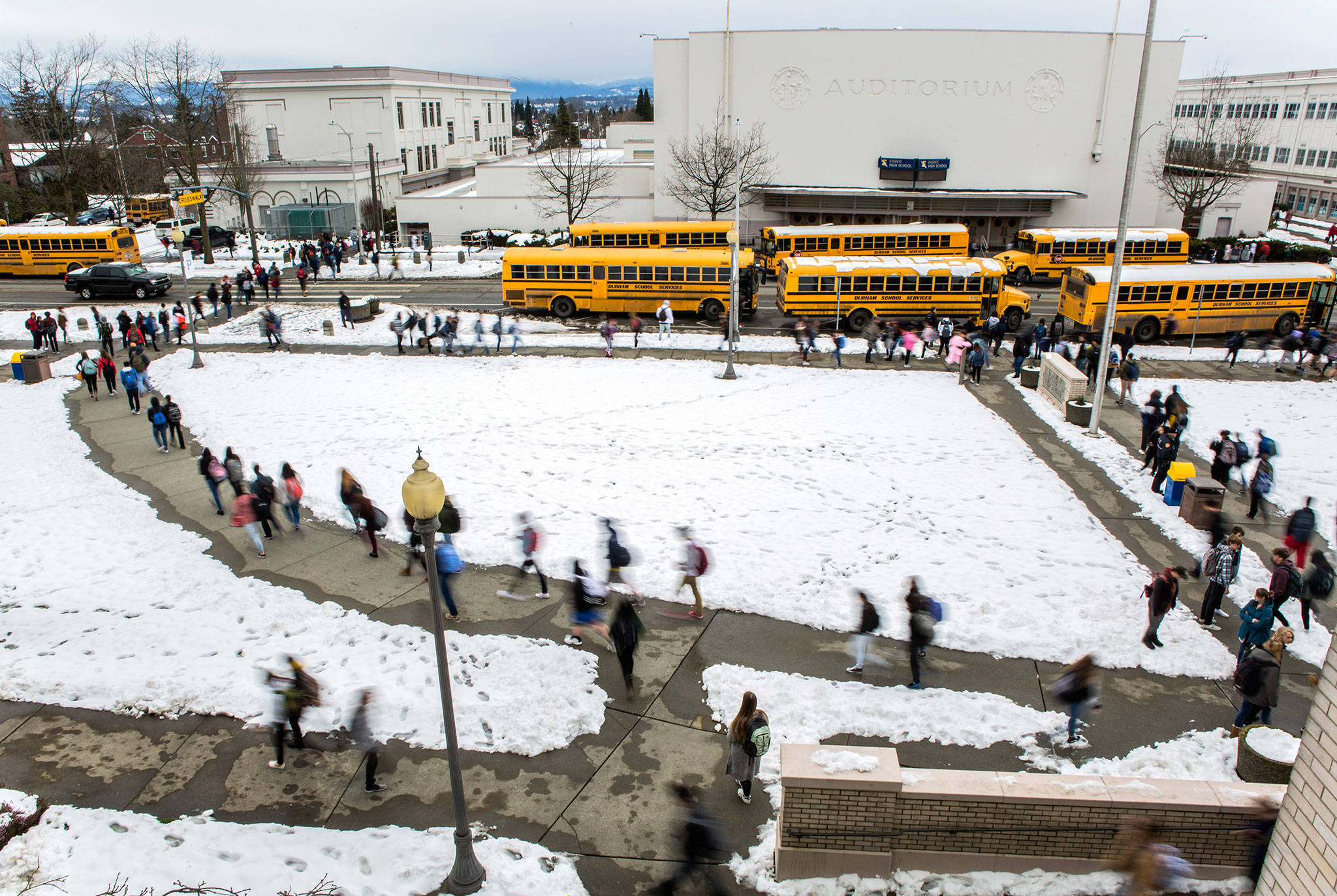 Students exit Everett High School on Feb. 14, which was their first day of school after snow closed classes on Feb. 8. (Olivia Vanni / The Herald)