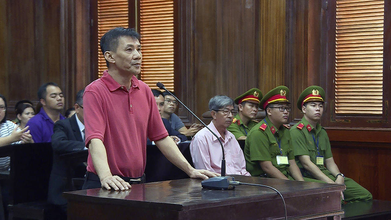Michael Nguyen stands during his trial Monday in Ho Chin Minh City, Vietnam. The American of Vietnamese origin was sentenced to 12 years in prison for “attempt to overthrow the state.” (Nguyen Thanh Chung/Vietnam News Agency via AP)