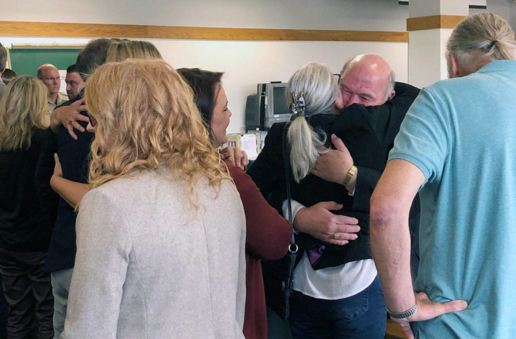 Detective Jim Scharf hugs Lee Cook, mother of Jay Cook, after a jury found William Talbott II guilty of two counts of aggravated murder in a trial that was the first of its kind. (Caleb Hutton / The Herald)
