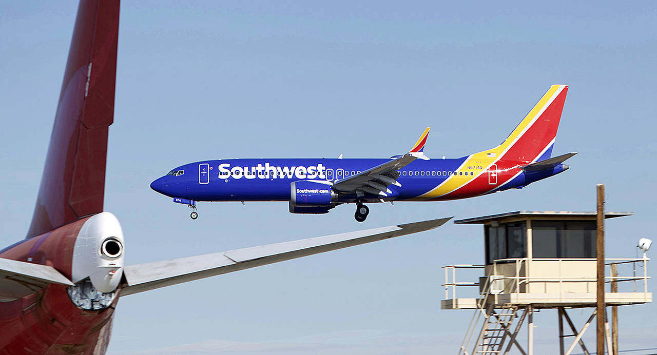 In this March 23 photo, a Southwest Airlines Boeing 737 Max aircraft lands at the Southern California Logistics Airport in the high desert town of Victorville, California. (AP Photo/Matt Hartman, File)