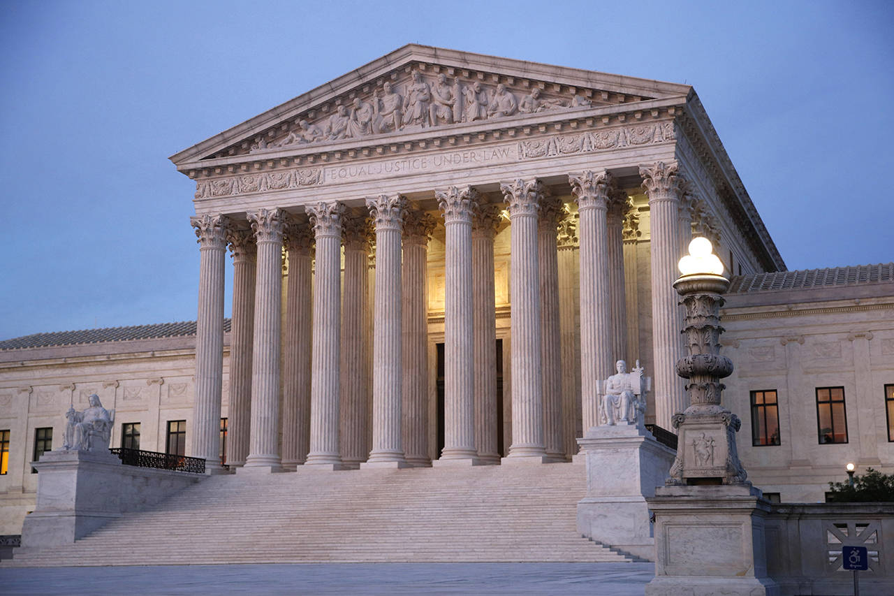In this May 23 photo, the U.S. Supreme Court building is shown at dusk on Capitol Hill in Washington. (AP Photo/Patrick Semansky)