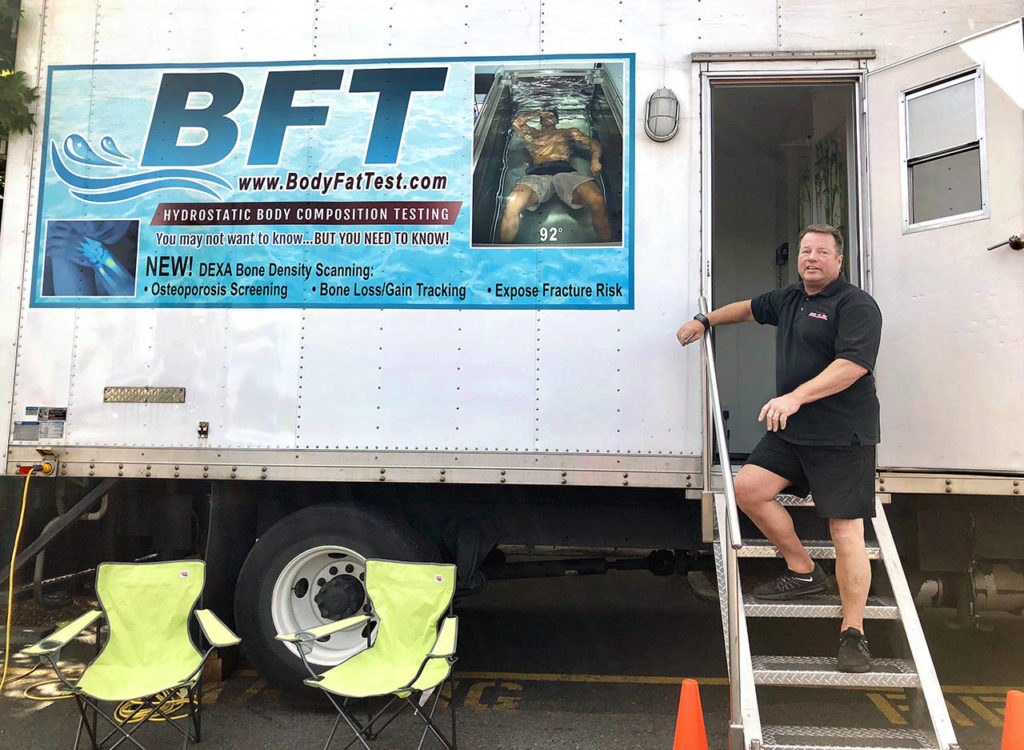 Brian Lee takes his Body Fat Test truck to fitness centers and corporate events. Inside is a dunk tank that measures body composition using the hydrostatic underwater method. (Andrea Brown / The Herald)
