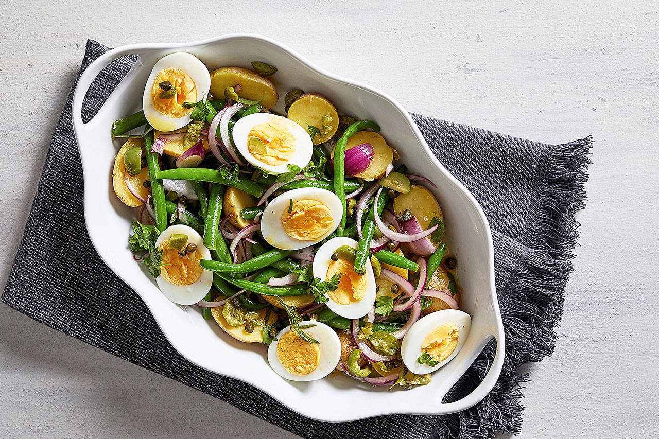 This nicoise-esque salad features green beans, potatoes, capers and eggs. (Photo by Stacy Zarin Goldberg for The Washington Post)