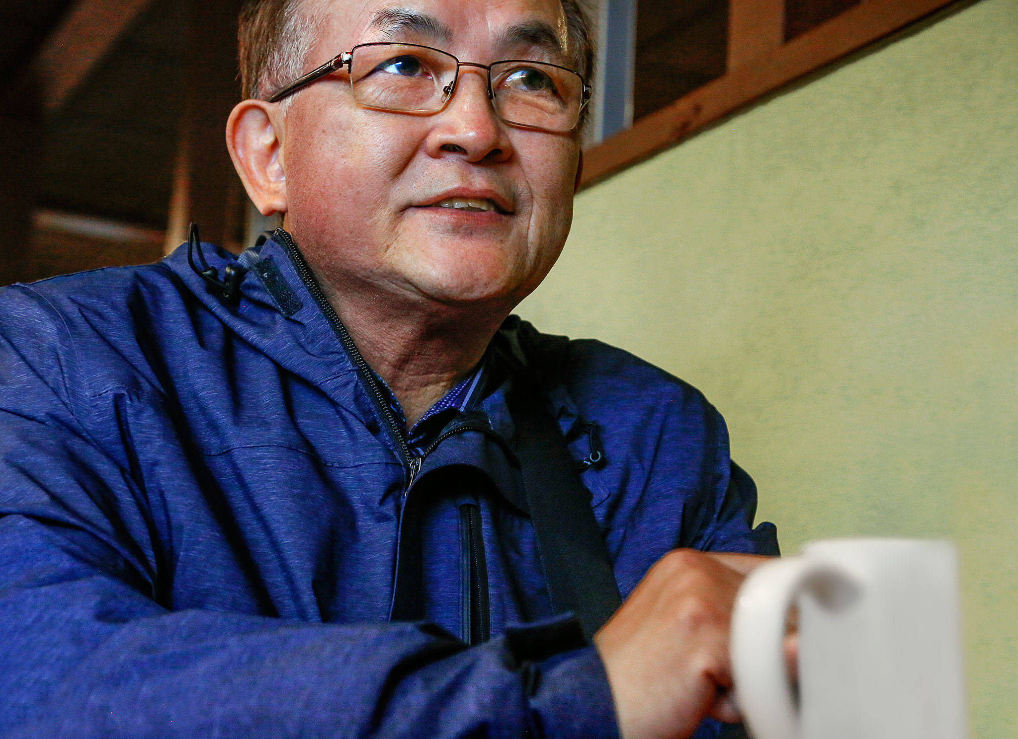 Lynnwood’s Jin So, who came from South Korea in the 1970s, talks about President Donald Trump’s step across the DMZ into North Korea last weekend. (Dan Bates / The Herald)