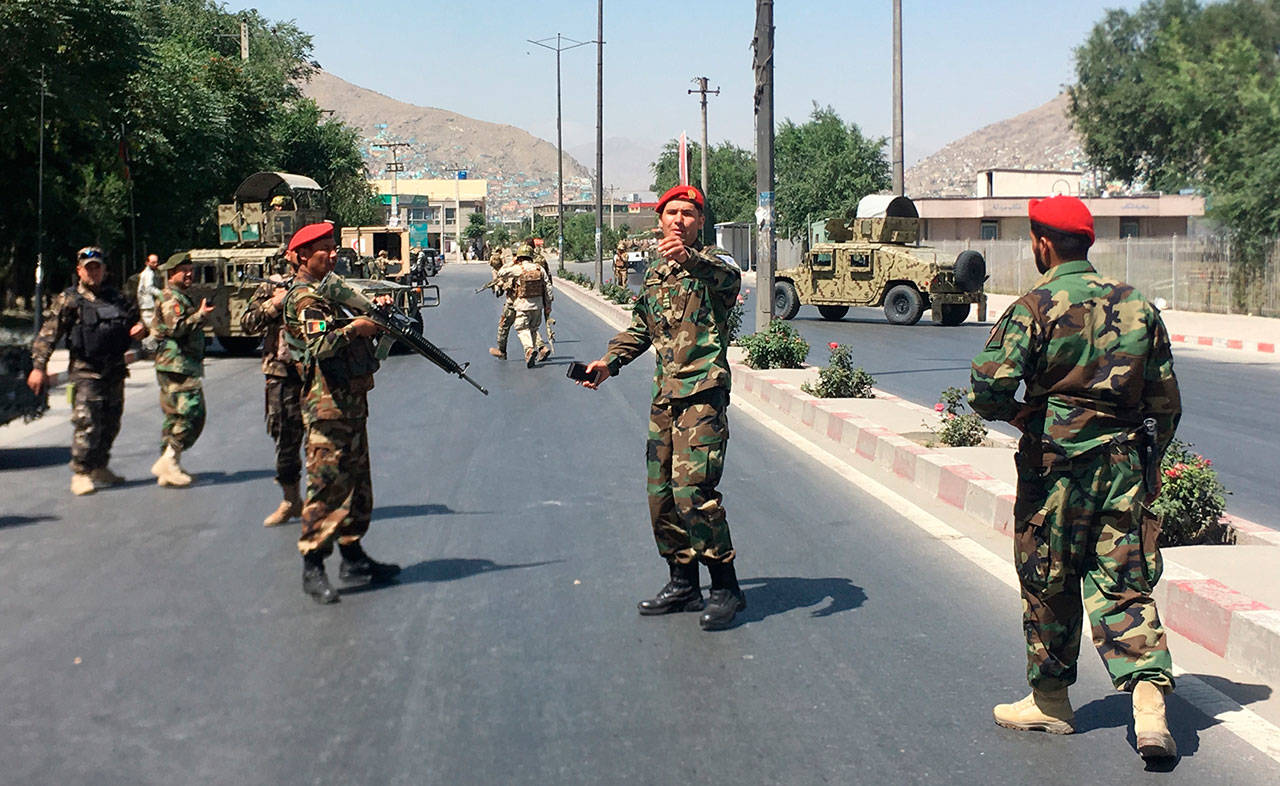 Afghan security forces arrive at the site of an explosion in Kabul, Afghanistan, on Monday. A powerful bomb blast rocked the Afghan capital early Monday, rattling windows, sending smoke billowing from Kabul’s downtown area, officials and a medic said.(AP Photo/Rahmat Gul)
