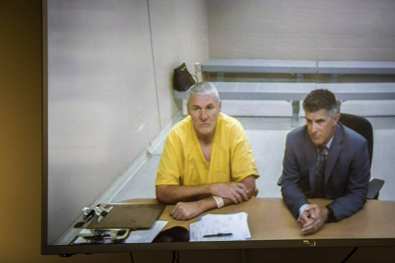 Former Washington State quarterback and Superbowl MVP Mark Rypien appears alongside defense attorney Chris Bugbee via video conference for a hearing presided over by commissioner Kristin O’Sullivan on July 1 in Spokane. Rypien was arrested for alleged fourth-degree domestic violence against his wife. (Libby Kamrowski/The Spokesman-Review via AP)