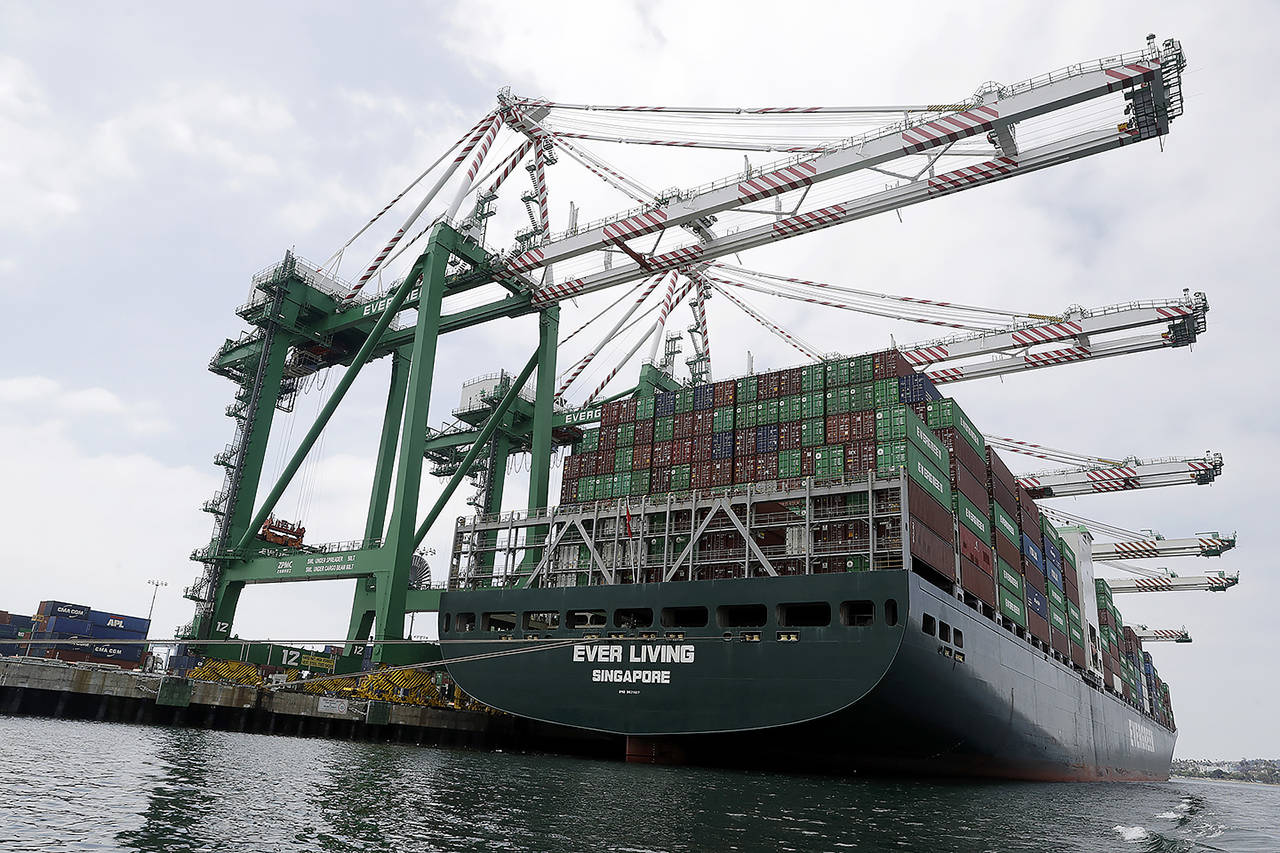 In this June 19 photo, a cargo ship is docked at the Port of Los Angeles in Los Angeles. (AP Photo/Marcio Jose Sanchez, File)