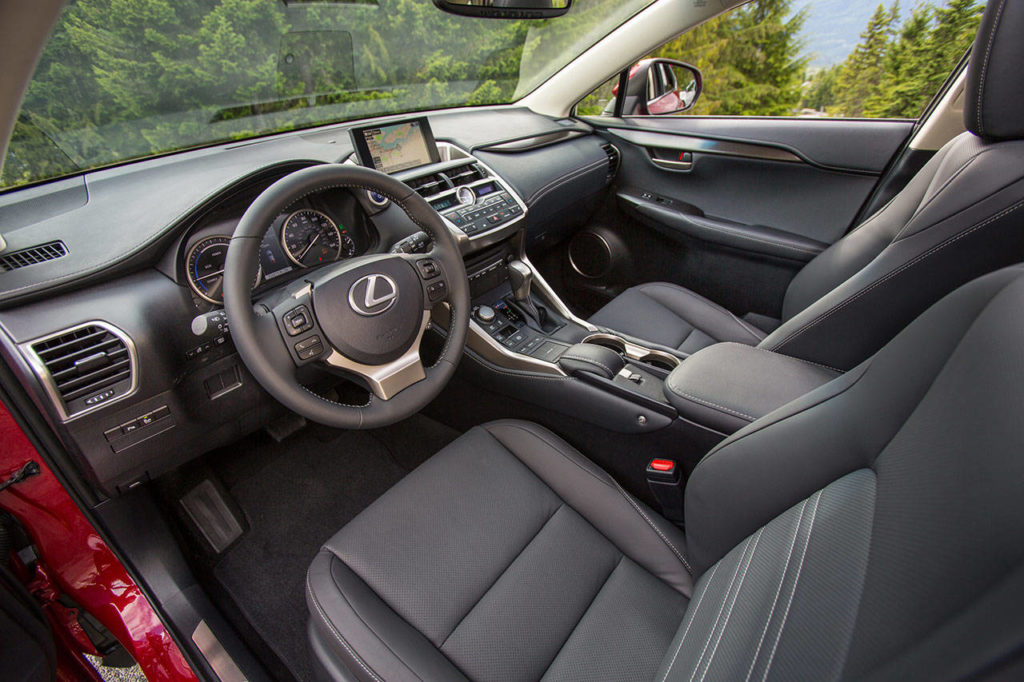 A touchpad in the center console of the 2019 Lexus NX 300h operates the infotainment system, but traditional buttons and dials are included for those who prefer them. (Manufacturer photo)

