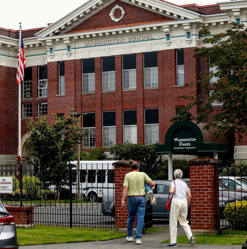 The former Washington School, now Washington Oakes retirement community, provides comfortable homes for seniors in north Everett. The building is one of two former Everett schools with new uses. The other, New Life Church, was once Roosevelt Elementary School. (Dan Bates / The Herald)
