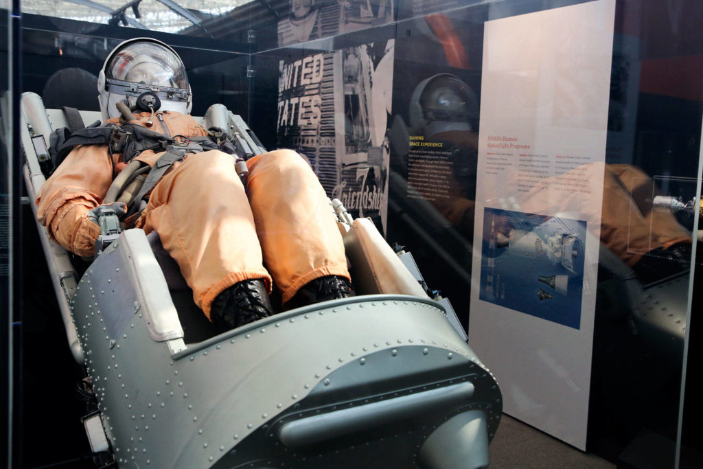 The SK-1 spacesuit, worn by Vostok cosmonauts during training, is part of the “Destination Moon: The Apollo Mission” exhibit. (Kevin Clark / The Herald)
