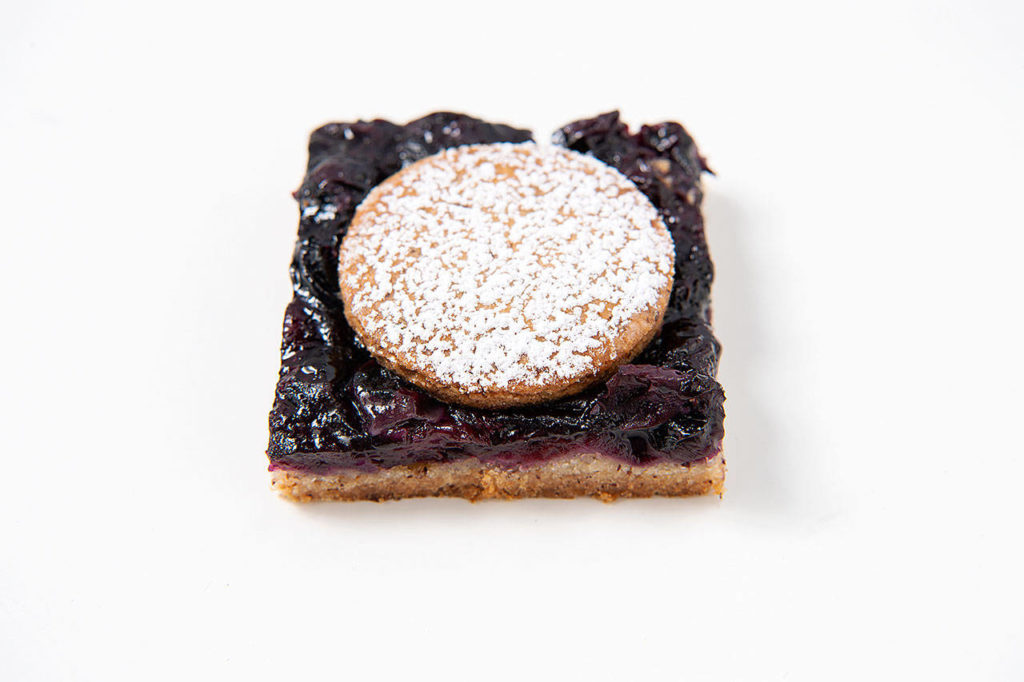 Blueberry bars with a nutty press-in crust. (Mariah Tauger/Los Angeles Times)
