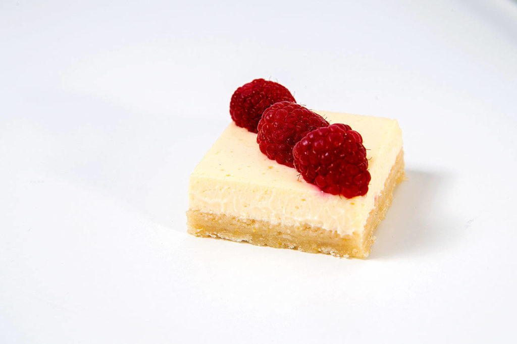 Fresh summer fruit is the perfect topping for creamy lemon bars. (Mariah Tauger/Los Angeles Times)
