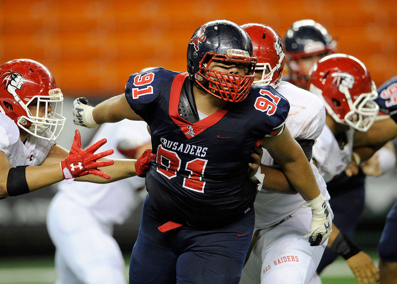 Saint Louis High School defensive lineman Faatui Tuitele (91) turns to follow the football during a game against Kahuku on Sept. 7, 2018, in Honolulu, Hawaii. (Bruce Asato / Honolulu Star-Advertiser)