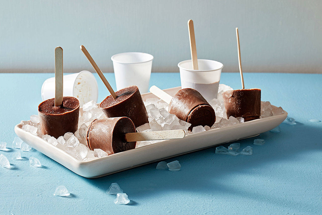 The chocolate mixture for these popsicles is essentially a simple pudding (albeit somewhat thinner than a typical pudding) that is poured into pop molds. (Photo by Tom McCorkle for The Washington Post)