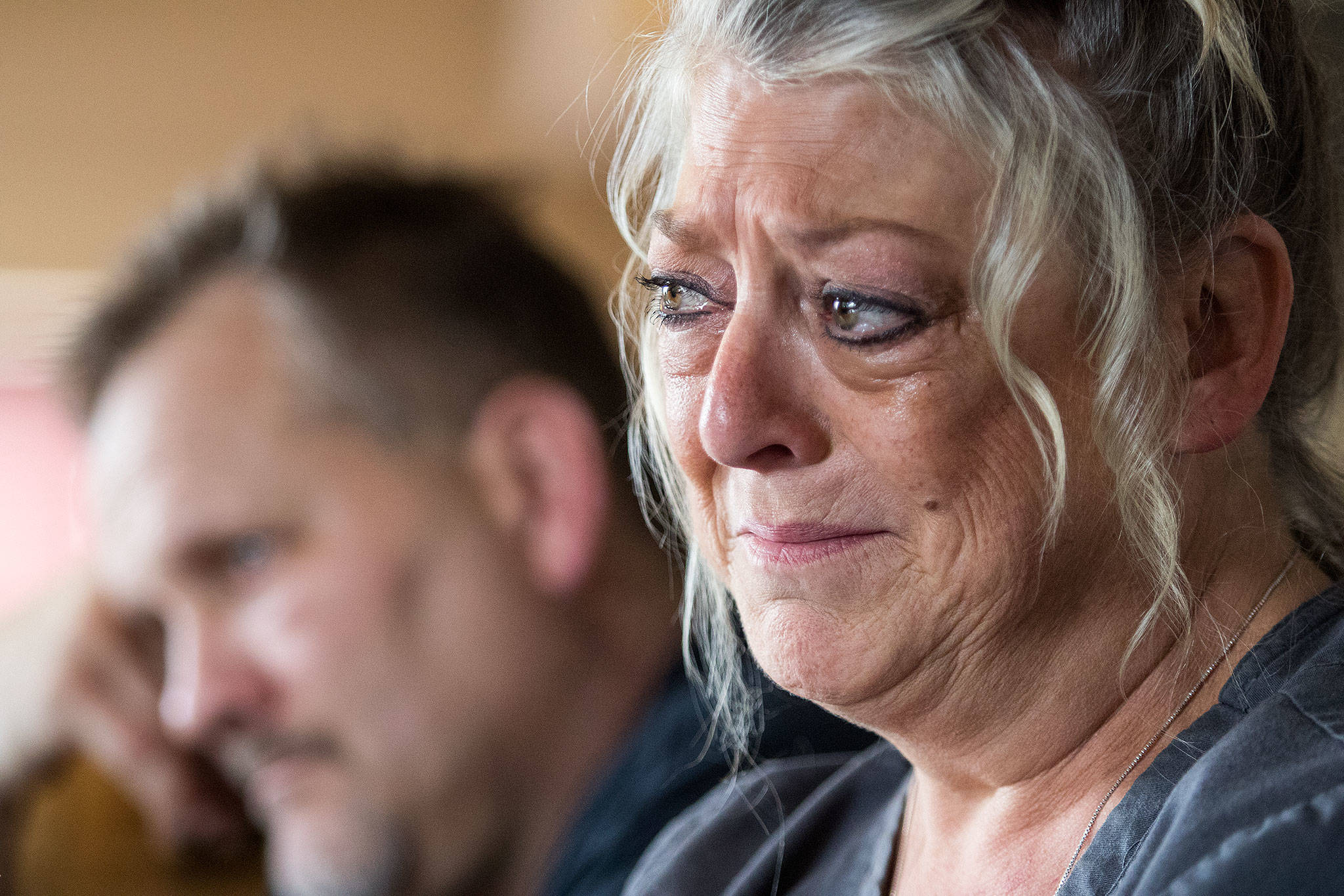 Leah Mctear (right) and Scott Mctear react as Jayme Fadden describes how Brandon Elias proposed to her as Brandon’s family talk about him on Monday in Everett. Elias was killed in a suspected DUI crash on July 5 in Everett. (Andy Bronson / The Herald)