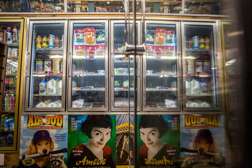 Old movie posters line the walls and freezers of Turners Neighborhood Grocery. (Olivia Vanni / The Herald)
