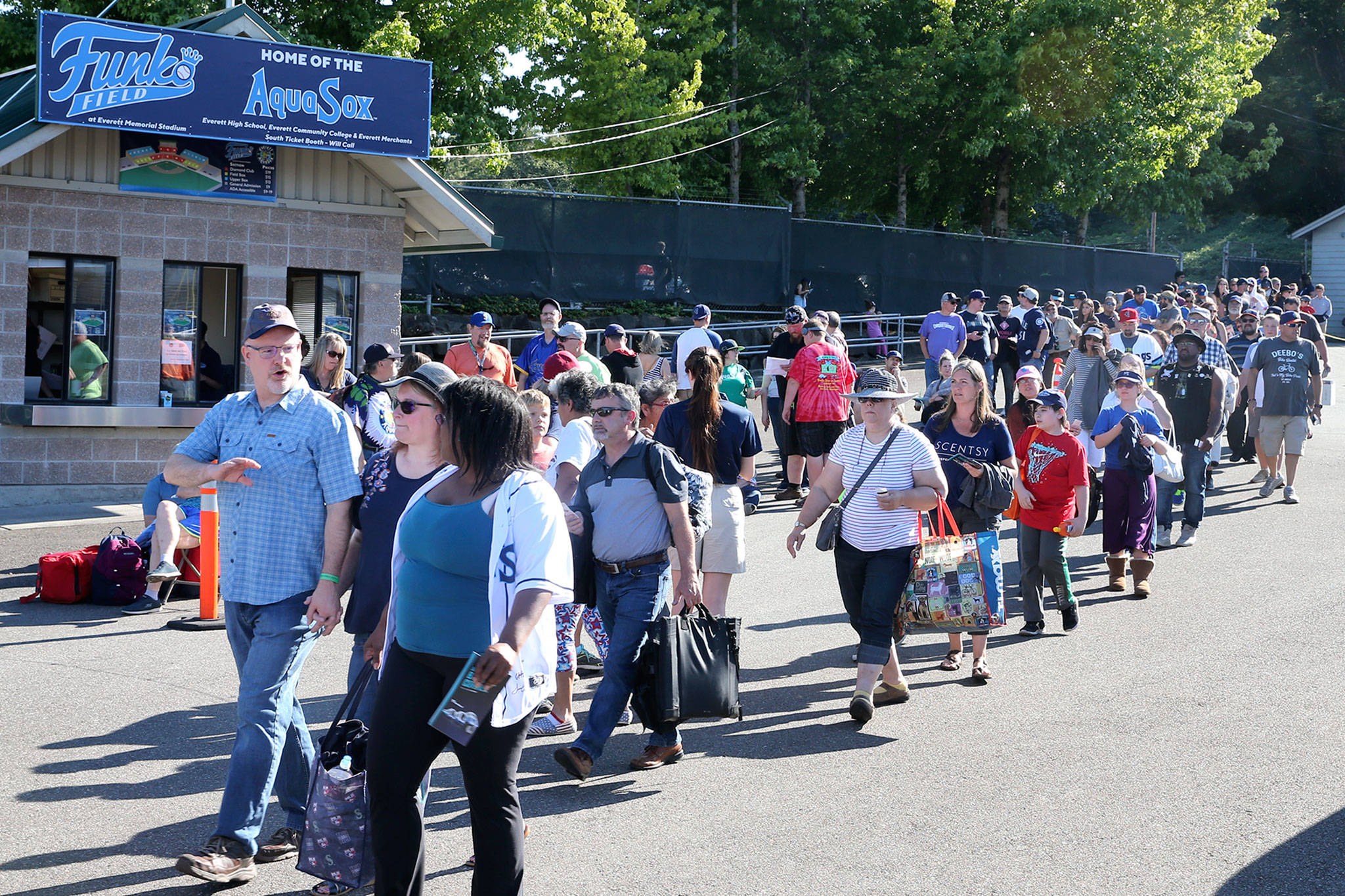 Season ticket holders enter the park on Funko Friday at Funko Field in Everett on July 12, 2019. (Kevin Clark / The Herald)
