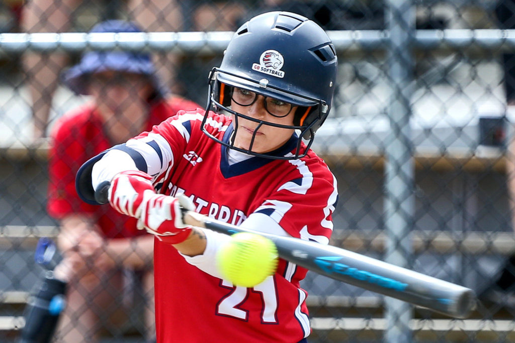 Aubrey Peterson makes contact with the ball during a Canada Cup softball game on July 11 in Surrey, British Columbia.(Kevin Clark / The Herald)
