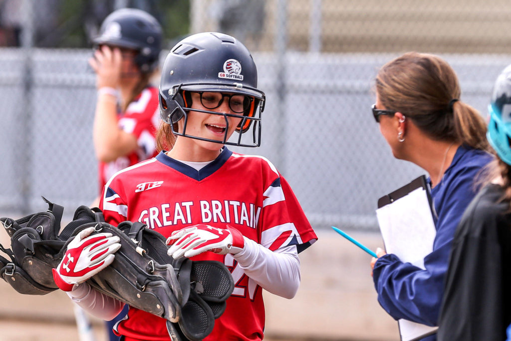 Aubrey Peterson makes her way to the dugout after scoring a run against New Zealand during the Canada Cup softball tournament on July 11 in Surrey, British Columbia. (Kevin Clark / The Herald)
