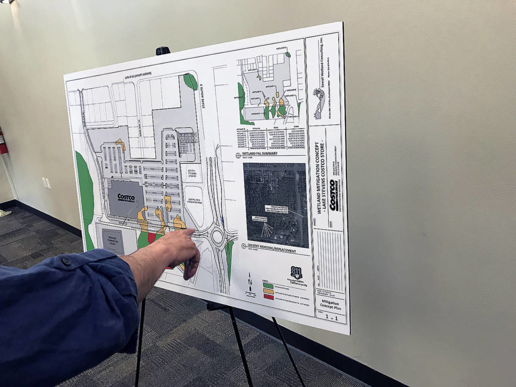 Poster boards at Thursday’s meeting included information about the wetlands on the proposed site, traffic increases and preliminary designs of the store. (Stephanie Davey / The Herald)
