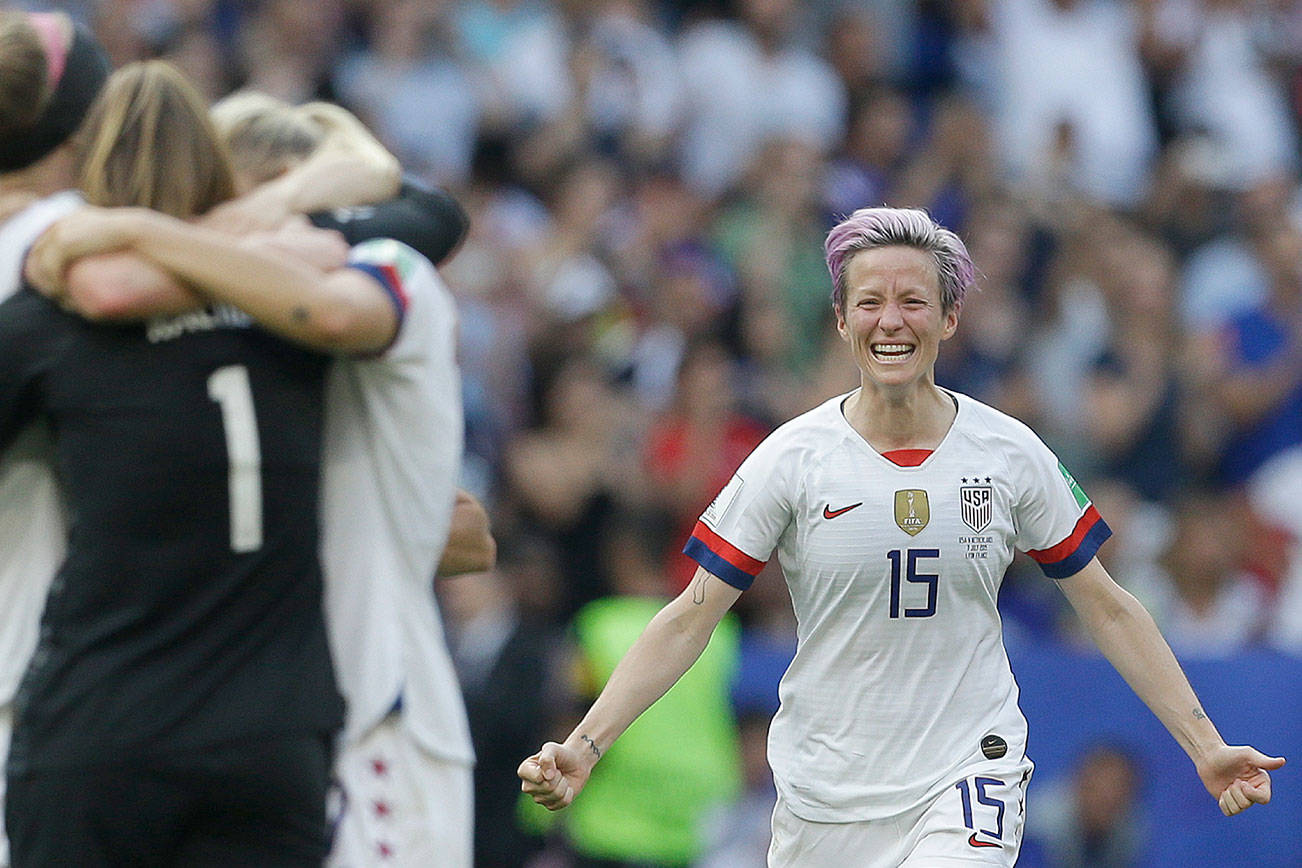 The United States’ Megan Rapinoe runs to teammates after the team won the Women’s World Cup final soccer match between US and The Netherlands at the Stade de Lyon in Decines, outside Lyon, France, Sunday, July 7, 2019. (AP Photo/Claude Paris)