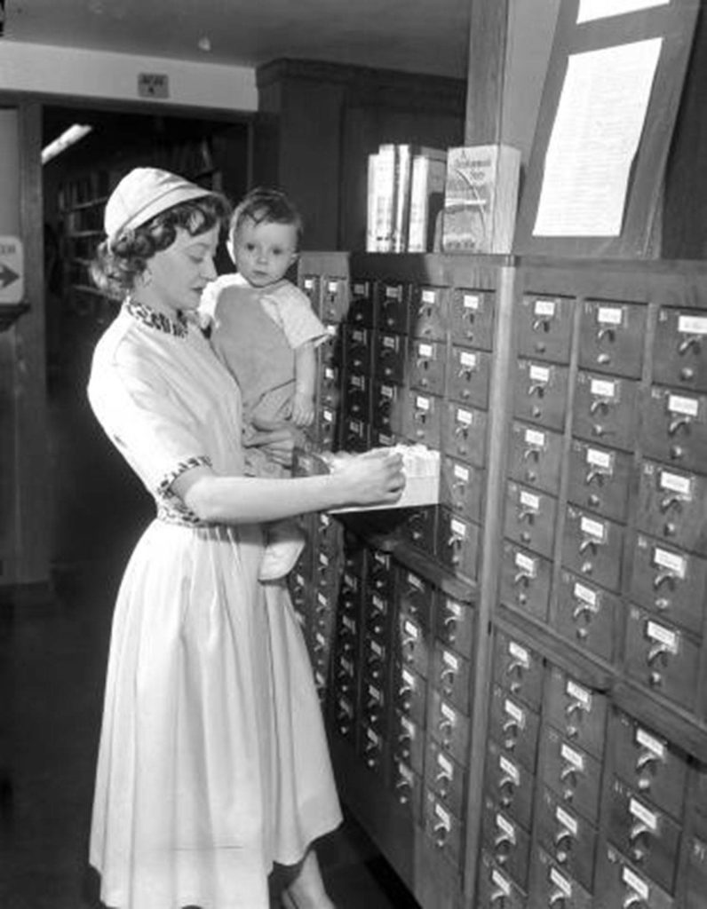 A woman and child in the Everett Public Library in 1956. (Everett Public Library)
