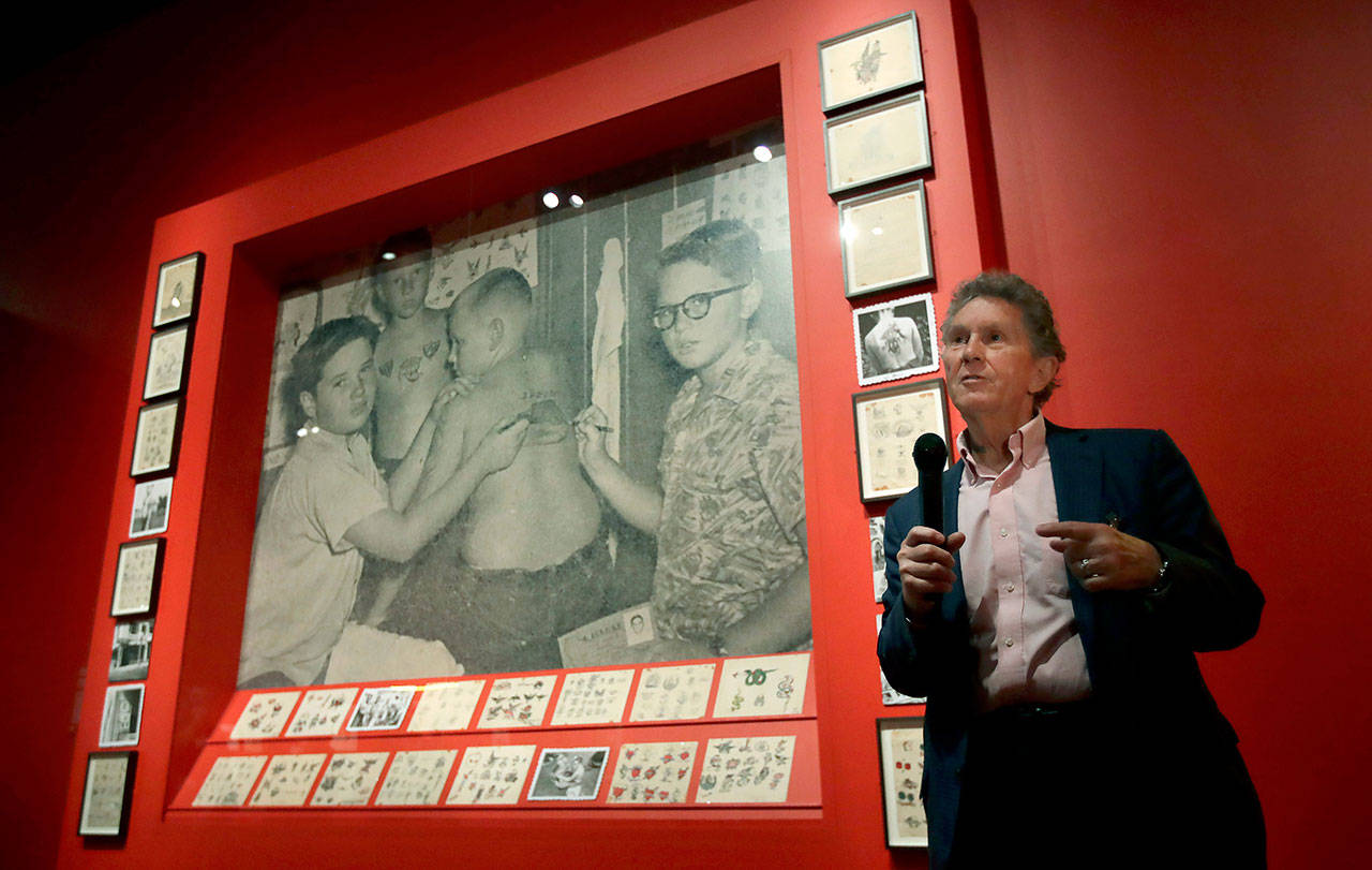 Ed Hardy speaks during a media preview of “Ed Hardy: Deeper than Skin” at the de Young Museum in San Francisco. (AP Photo/Jeff Chiu)