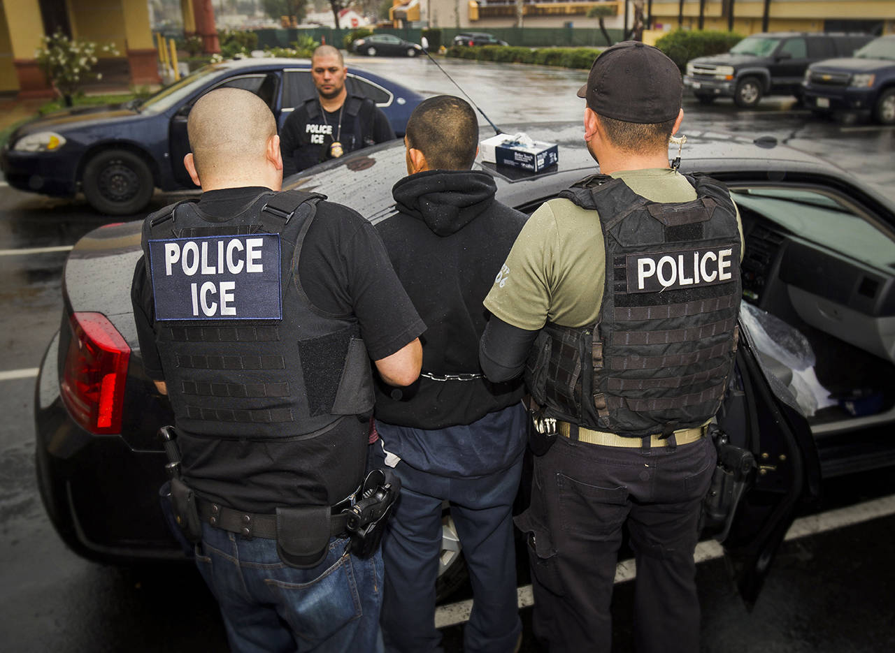 In this Feb. 7, 2017 photo, foreign nationals are arrested during a targeted enforcement operation conducted by U.S. Immigration and Customs Enforcement (ICE) aimed at immigration fugitives, re-entrants and at-large criminal aliens in Los Angeles. (Charles Reed/U.S. Immigration and Customs Enforcement via AP, File)