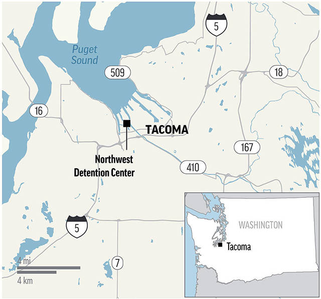 Police kill man allegedly attacking Tacoma immigration center
