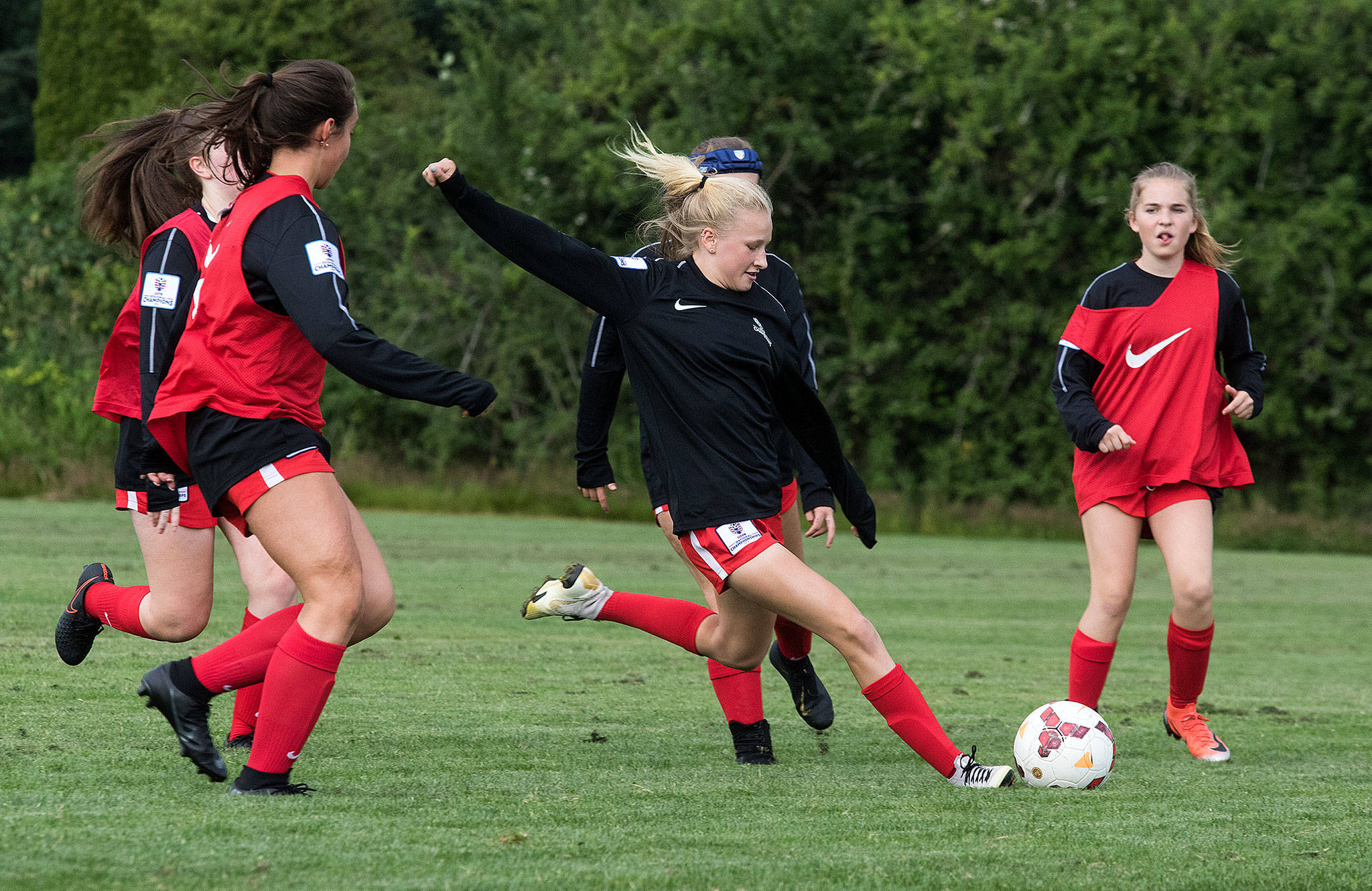 Snohomish United’s Kirsten Crane (center) takes a shot at goal during a July 11 practice at Stocker Fields in Snohomish. Crane netted nine goals while helping Snohomish United G05 Black win a Far West regional title to earn a spot in the U.S. Youth Soccer National Championships. (Andy Bronson / The Herald)