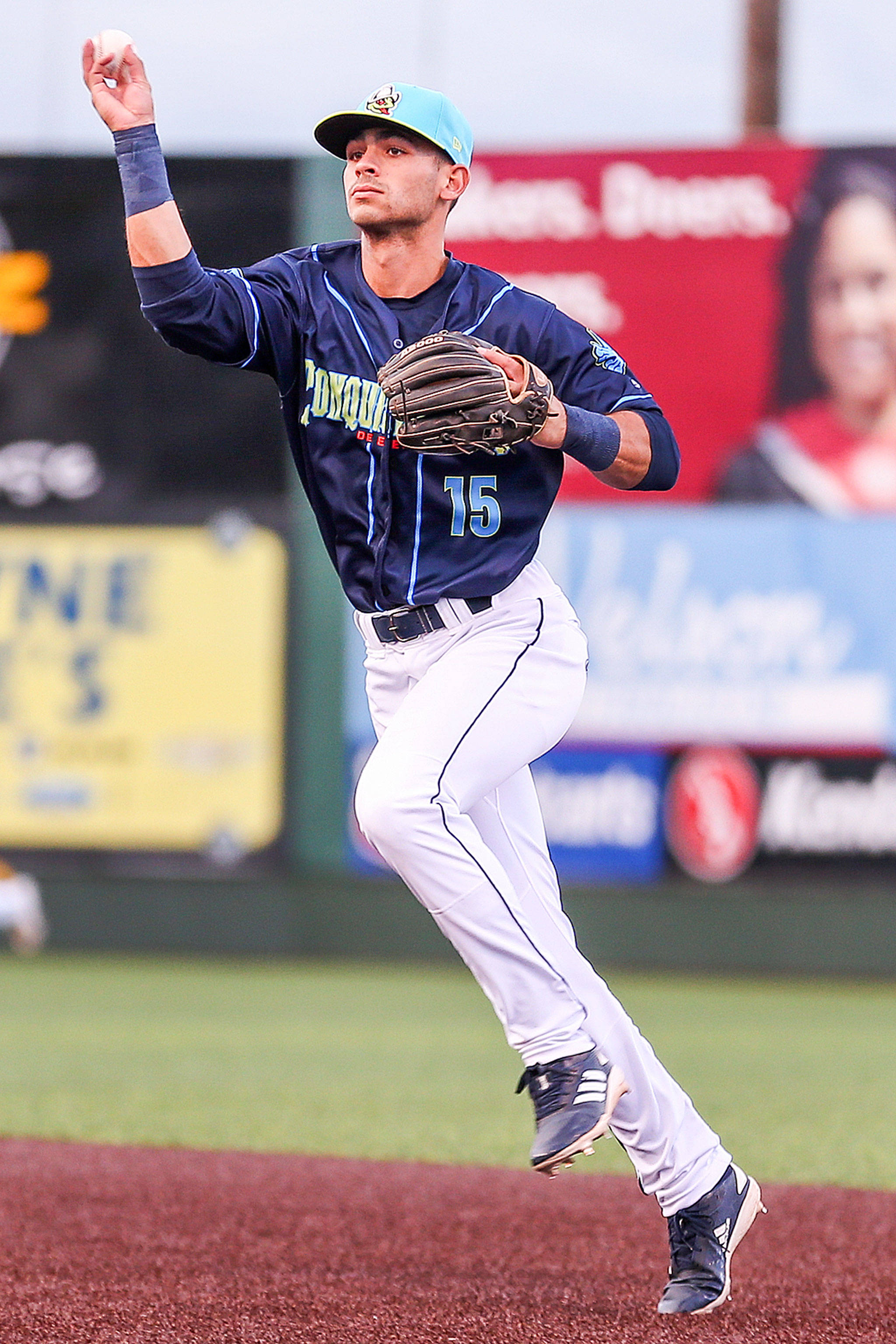The AquaSox’s Patrick Frick gathers a ground ball at third base during a game against the Canadians on July 12, 2019, at Funko Field in Everett. (Kevin Clark / The Herald)