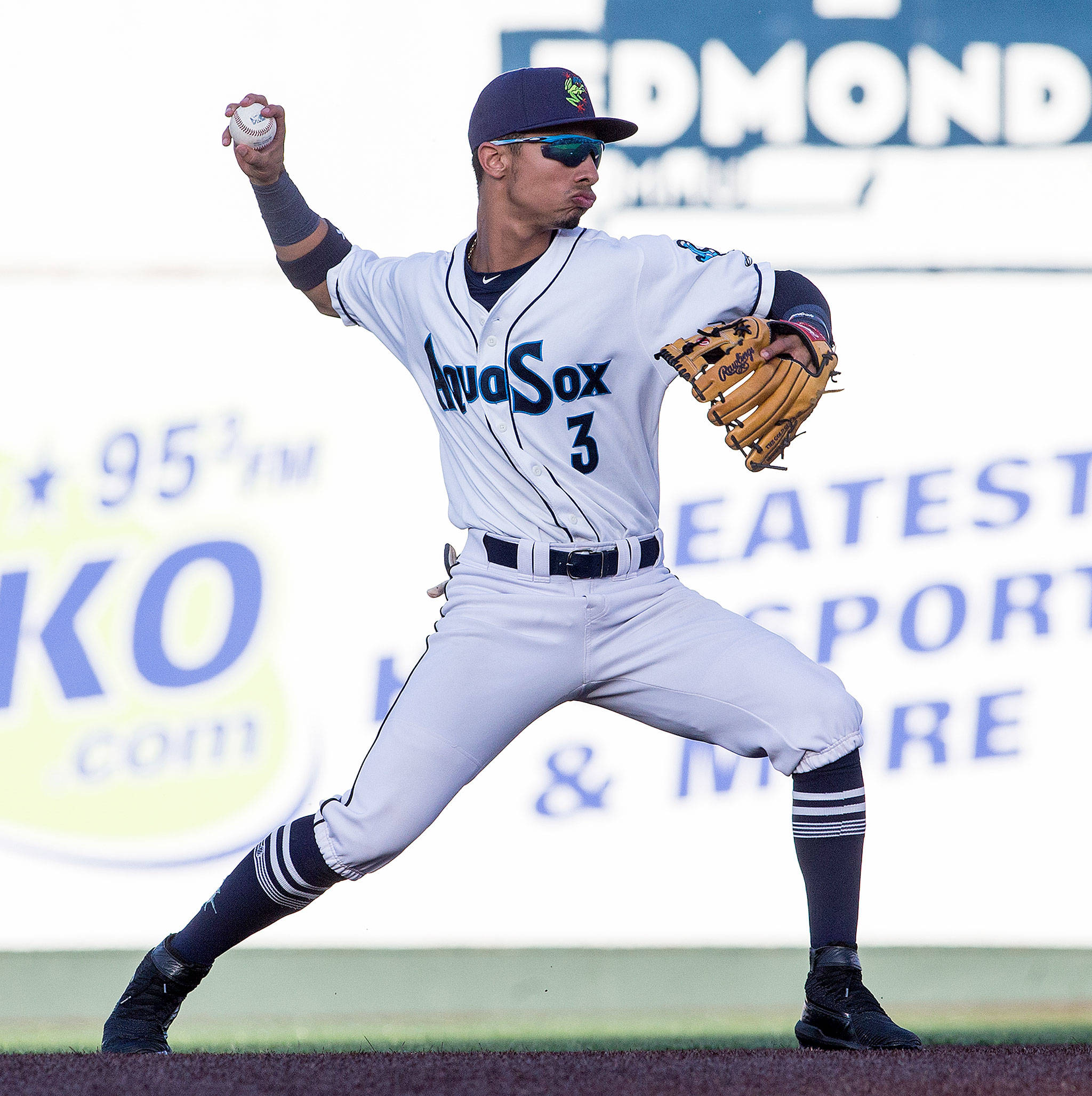 The AquaSox’s Cesar Izturis Jr. throws to first base during a game against the Volcanoes on June 21, 2019, at Funko Field at Everett Memorial Stadium. (Andy Bronson / The Herald)
