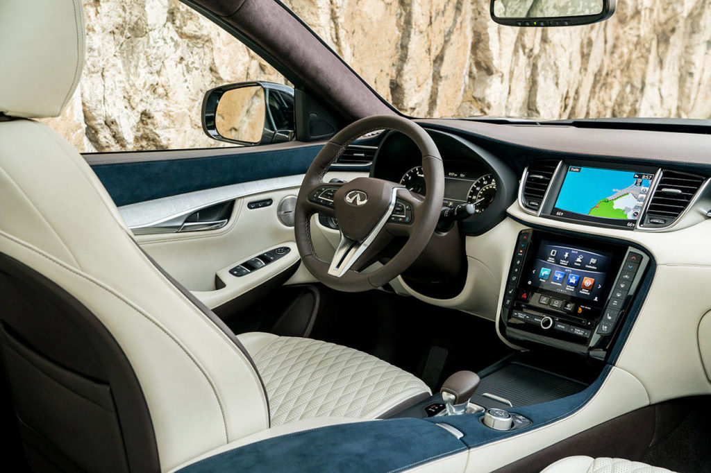 Diamond-quilted seats and blue ultrasuede trim highlight the interior of the 2019 Infiniti QX50. The Essential model’s interior is shown here. (Manufacturer photo)
