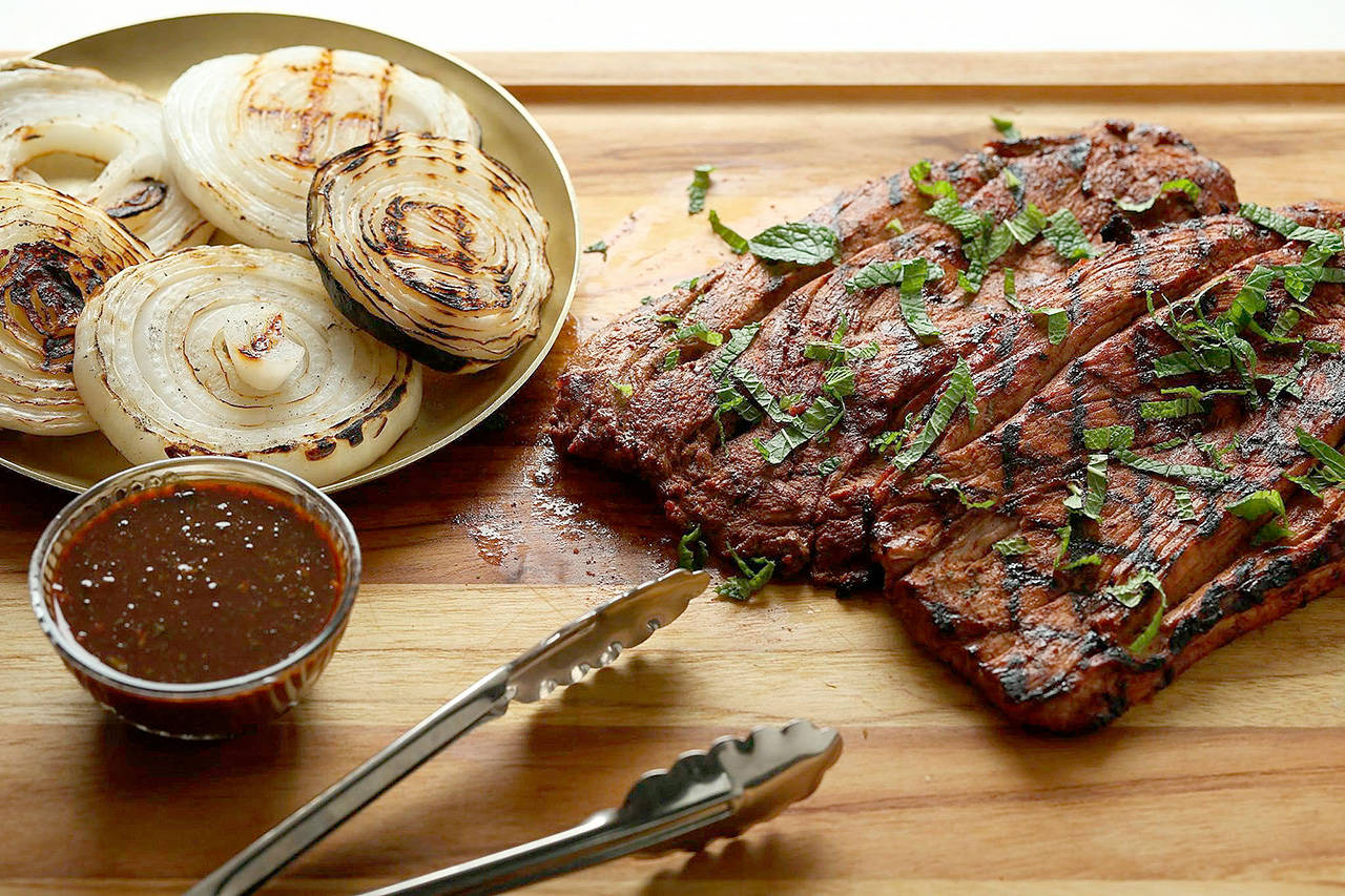 Hoisin-mint marinade transforms fast-cooking pork tenderloin from bland to bodacious. (E. Jason Wambsgans / Chicago Tribune)