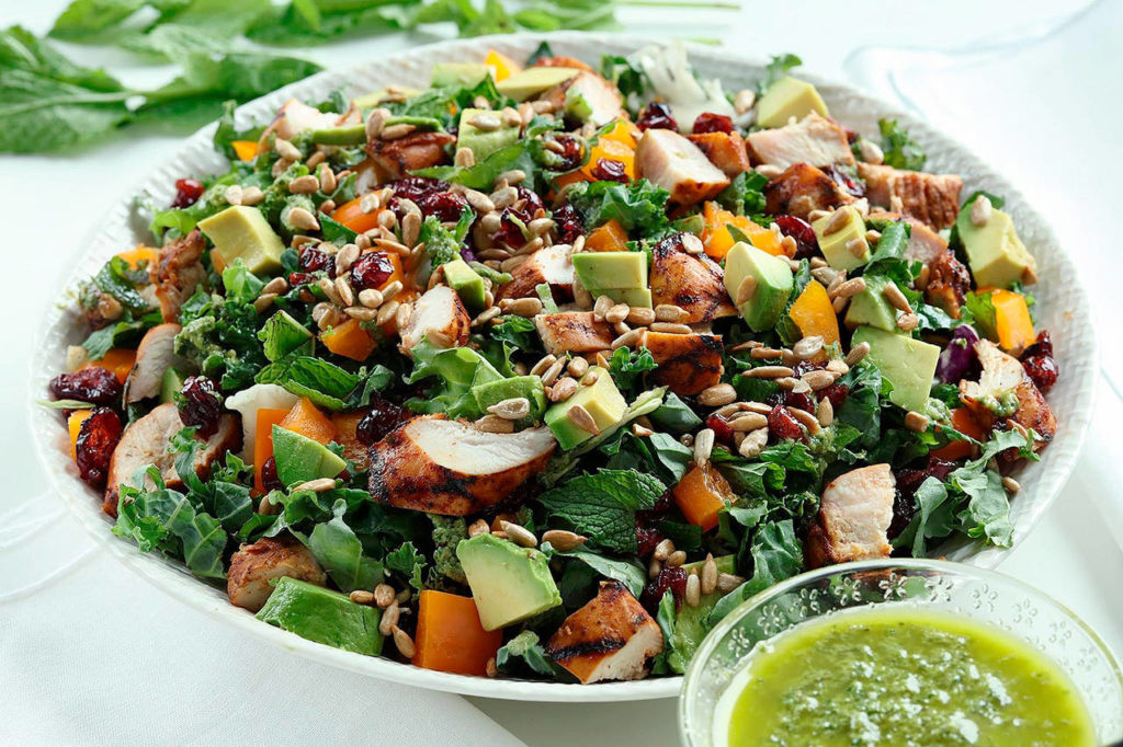 This minty grilled chicken salad also could be made with the hoisin-mint pork tenderloin. (E. Jason Wambsgans / Chicago Tribune)
