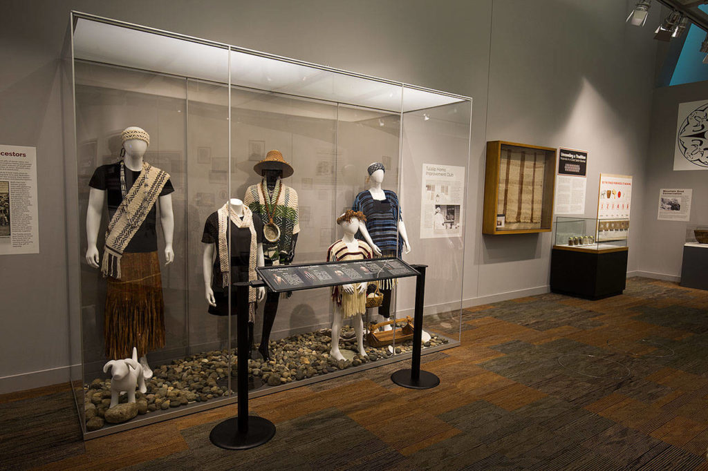 Examples of Salish Coast clothing behind a glass display at the Hibulb Cultural Center.
(Andy Bronson / The Herald) 
