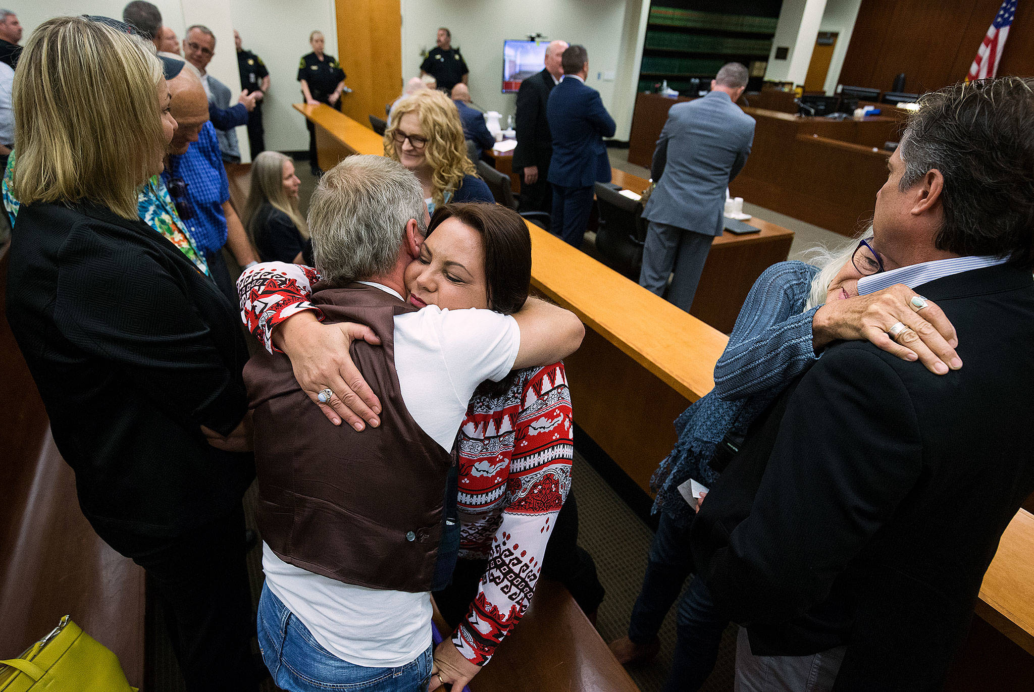 Jay Cook’s sister Laura Baanstra (center) hugs Doran Schiller, a family friend, while Jay’s mother, Lee Cook, embraces Gary Baanstra (right) after William Talbott II is sentenced at the Snohomish County Courthouse on Wednesday in Everett. (Andy Bronson / The Herald)