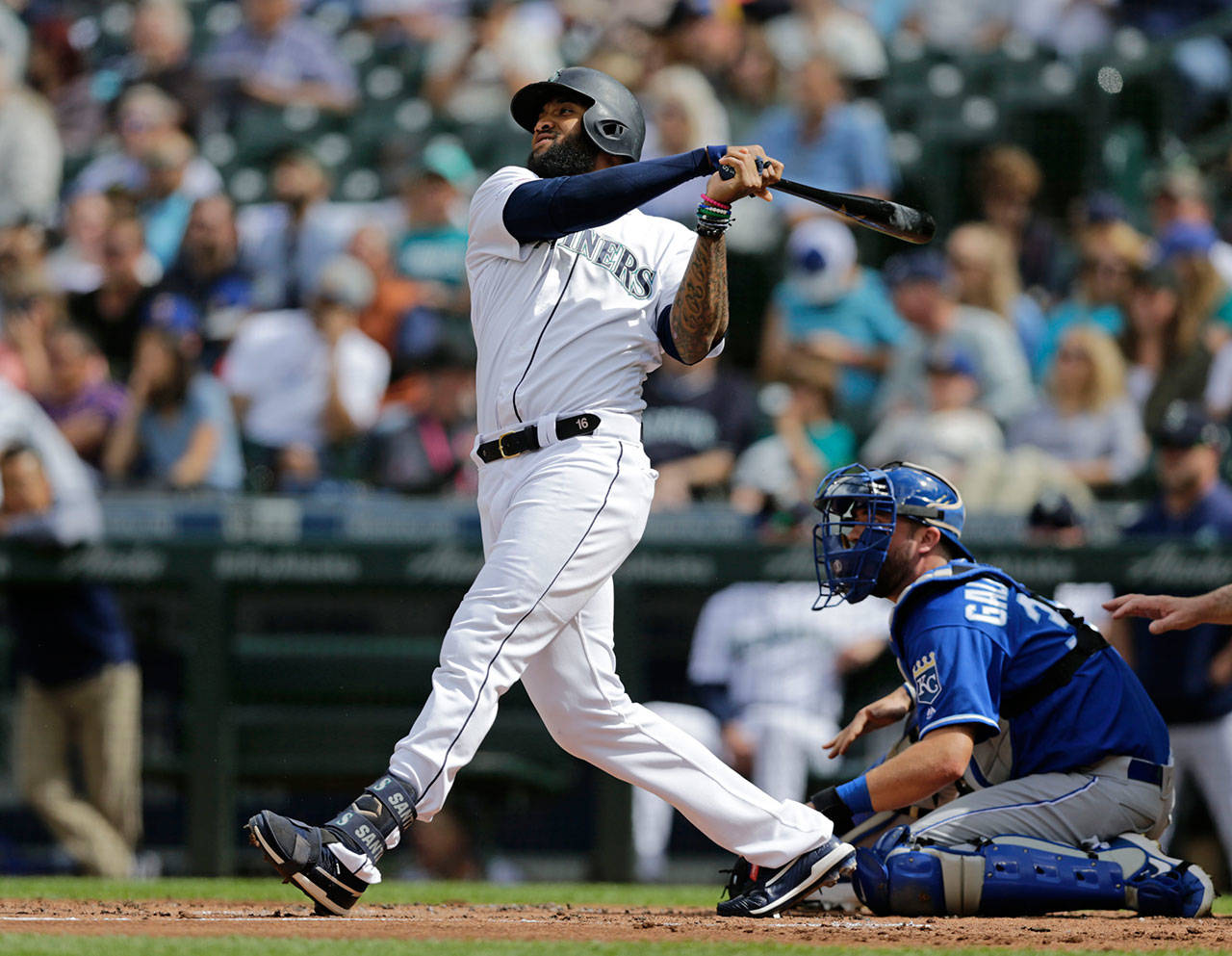The Mariners’ Domingo Santana watches his three-run home run during the first inning of a game against the Royals on June 19, 2019, in Seattle. (AP Photo/John Froschauer)