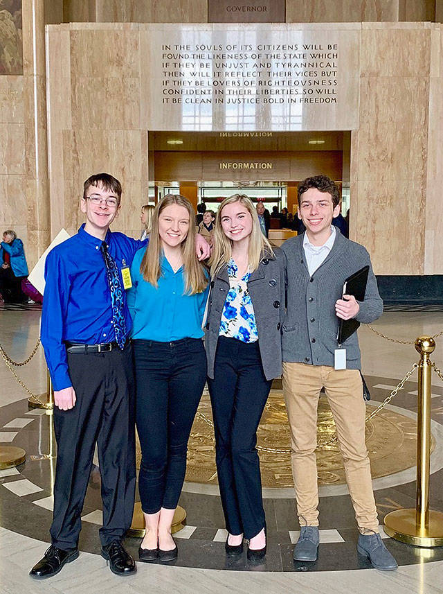 From left, Sam Adamson, Lori Riddle, Hailey Hardcastle, and Derek Evans pose Feb. 6 at the Oregon State Capitol in Salem, Oregon. The teens introduced legislation to allow students to take “mental health days” as they would sick days in an attempt to respond to a mental health crisis gripping the state. (Jessica Adamson/Providence Health & Services via AP)