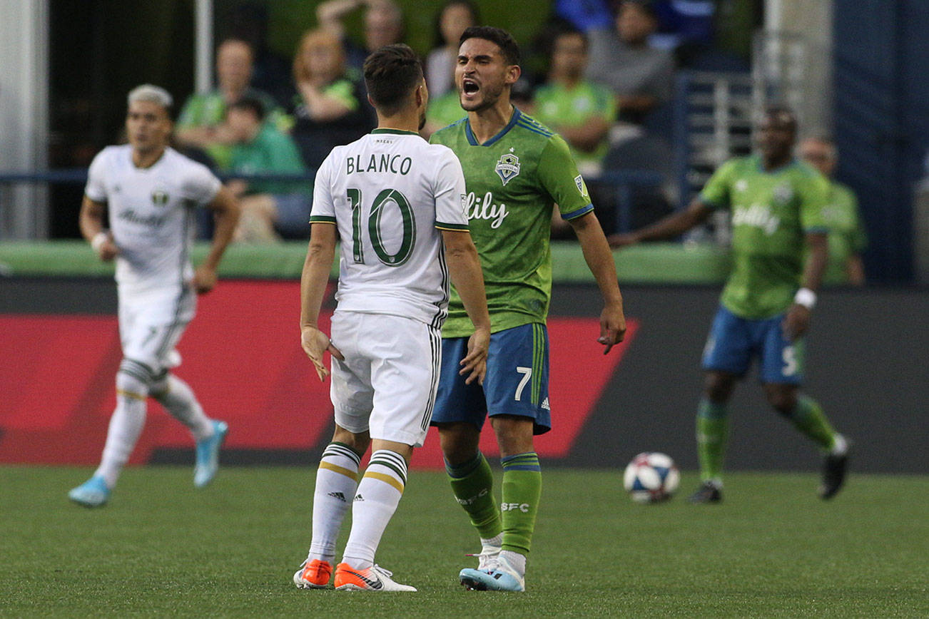 Tempers flare as Seattle Sounders Cristian Roldan and the Timbers’ Sebastian Blanco bump chests near the end of the game as Seattle lost 2-1 to the Portland Timbers at CenturyLink Field on Sunday, July 21, 2019 in Seattle, Wash. (Andy Bronson / The Herald)